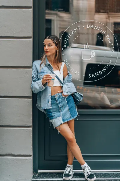 A Girl in Denim in Front of a Restaurant